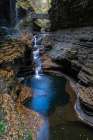 USA, New York. Series of waterfalls and bridge in Watkins Glen State Park. Art Print